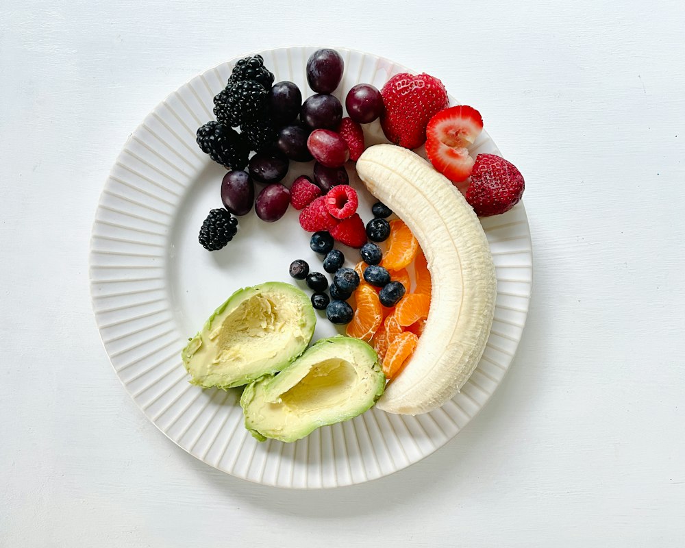 A variety of wholesome, minimally processed foods laid out on a wooden table — everyday ingredients for a blood-sugar-aware diet